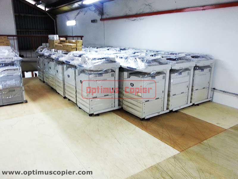 A large new number of copiers lined up in a warehouse ready for copier rental, provided by Optimus Copier company for Klang Valley (KL), Melaka and Negeri Sembilan.